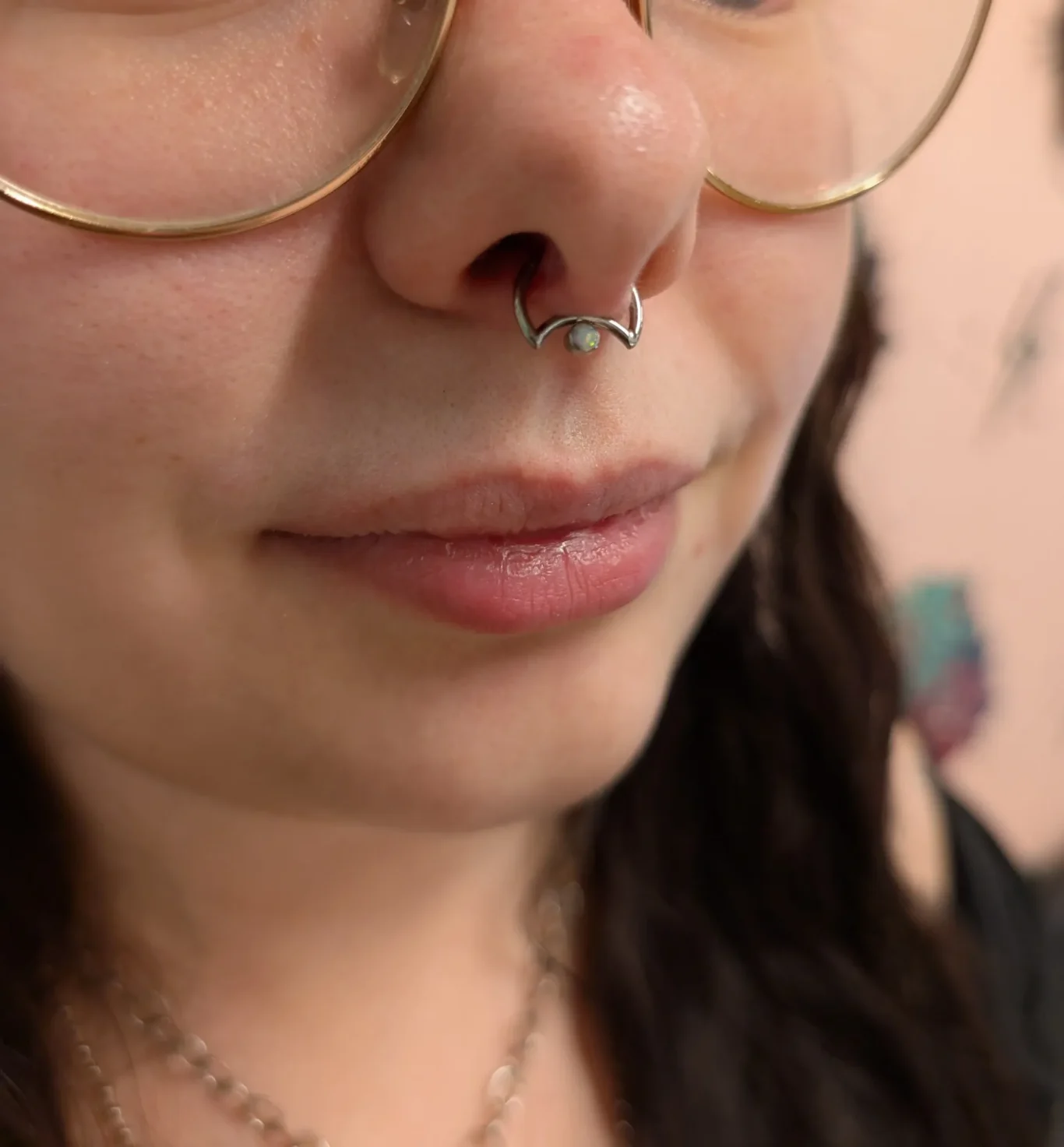 Septum Piercing Close up view of a septum piercing with unique half moon style jewellery.