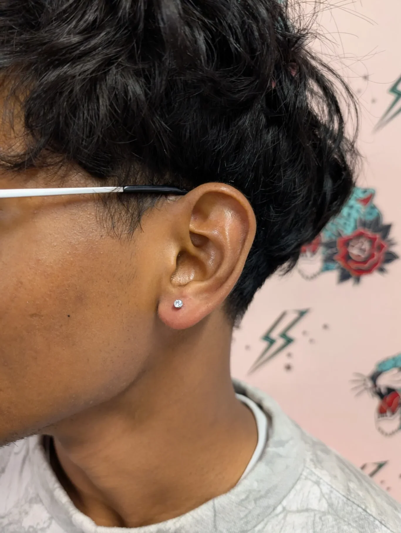 Left Ear Lobe Piercing Side view of a classic left ear lobe piercing.