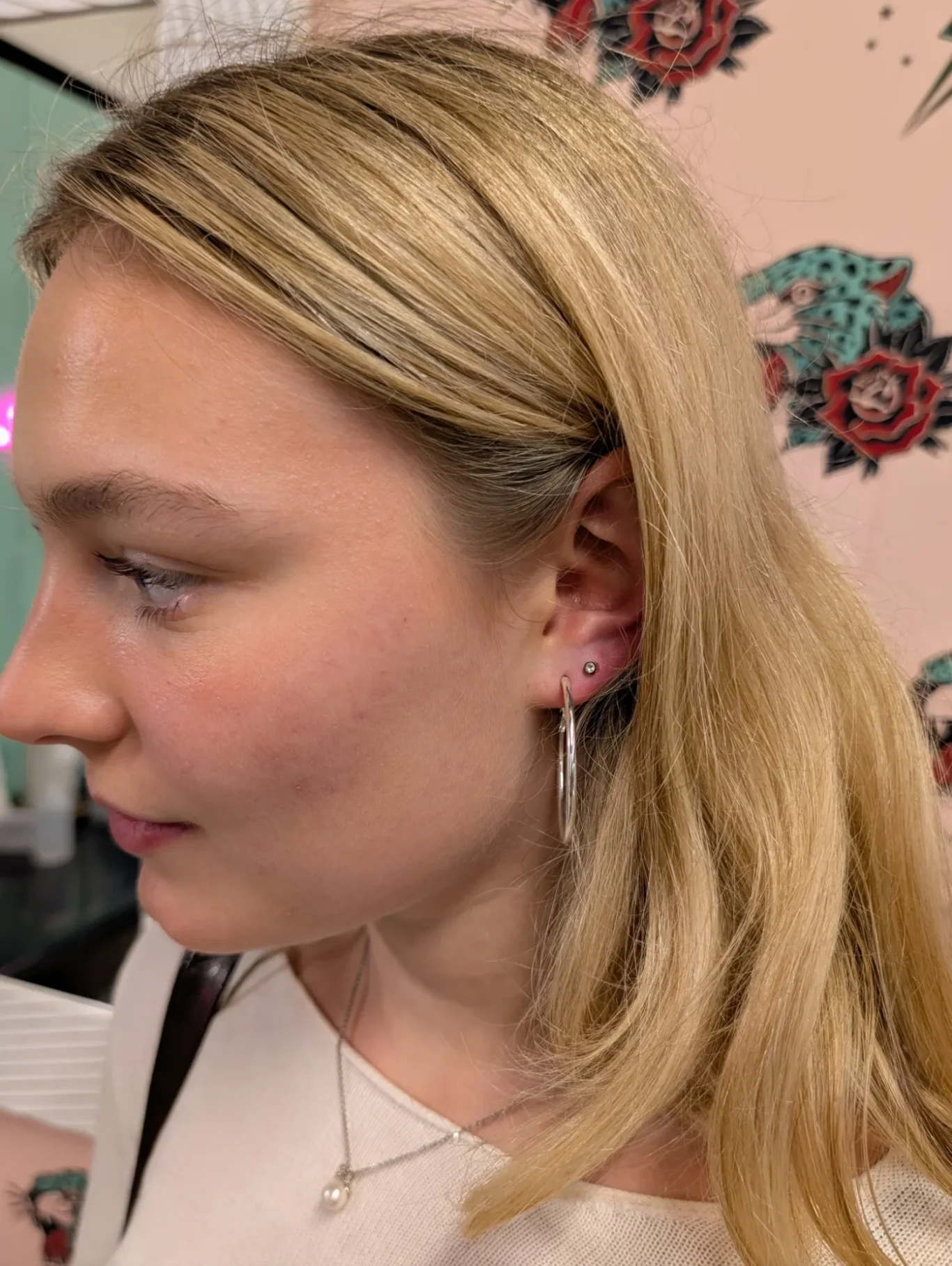 Left Second Ear Lobe Piercing Side view of a second ear lobe piercing on the left side.