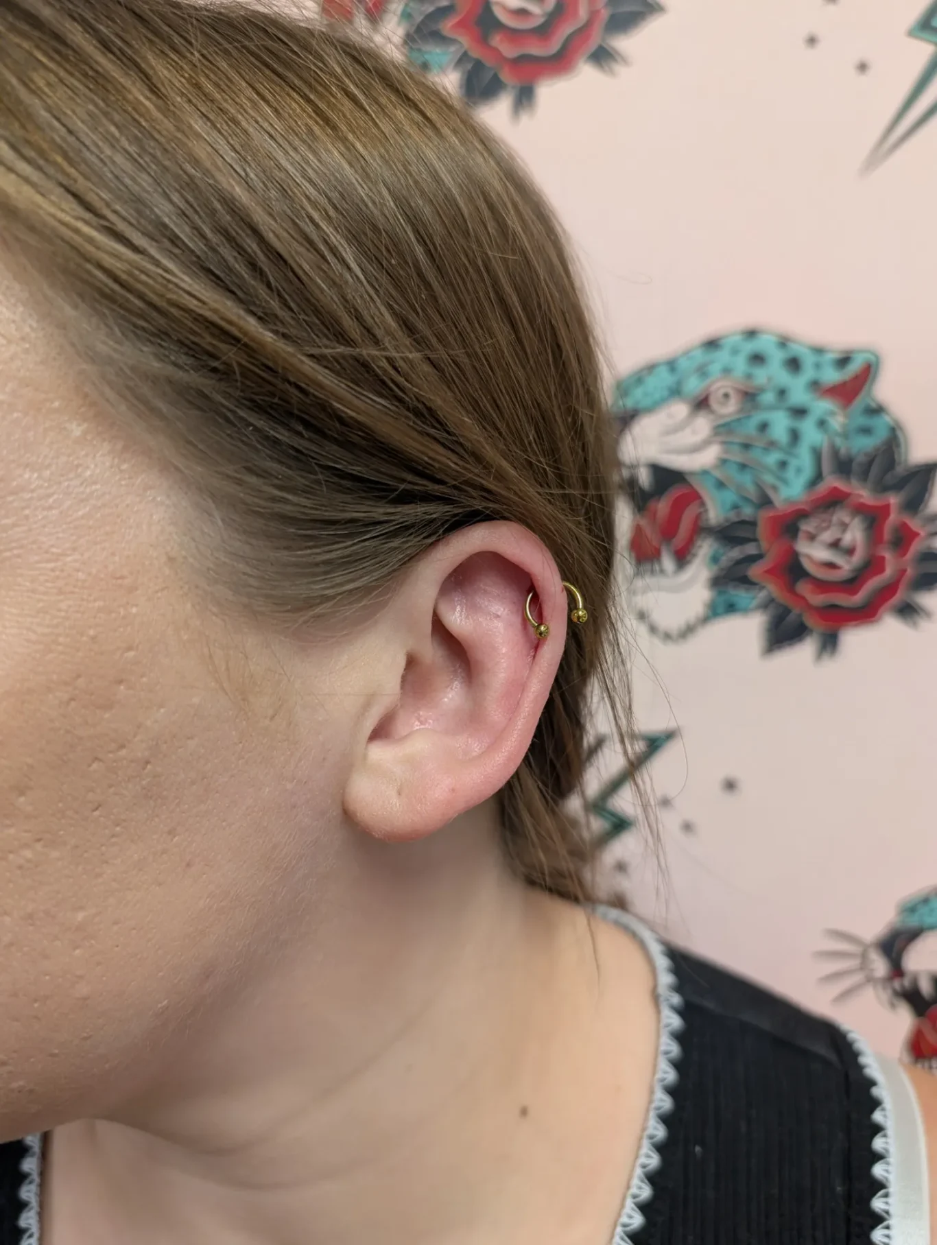 Upper Helix Ear Piercing Side view of a simple upper helix ear piercing.